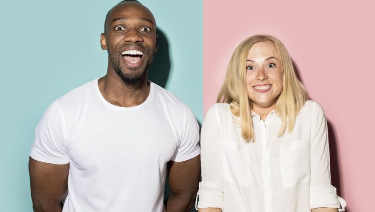 Interracial couple, black and white making funny faces.