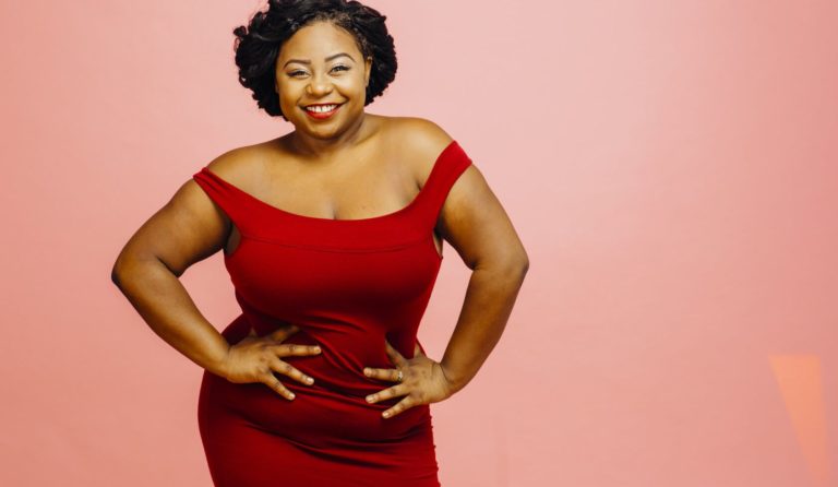 Plus size single in red dress being happy and ready to be dating