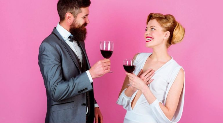Two singles drinking wine and looking for serious dating sites