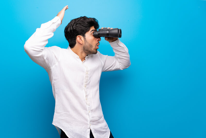 indian guy looking for love with binoculars