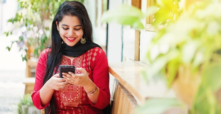 stunning indian girl on her phone