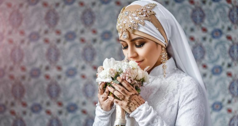 islamic bride smells flowers