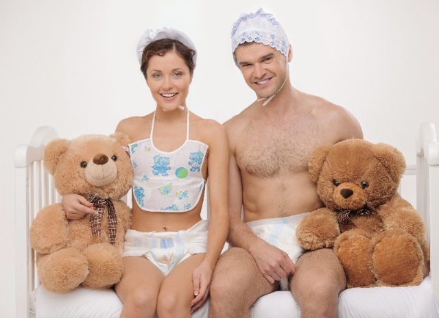A couple of adults in diapers with teddy bears