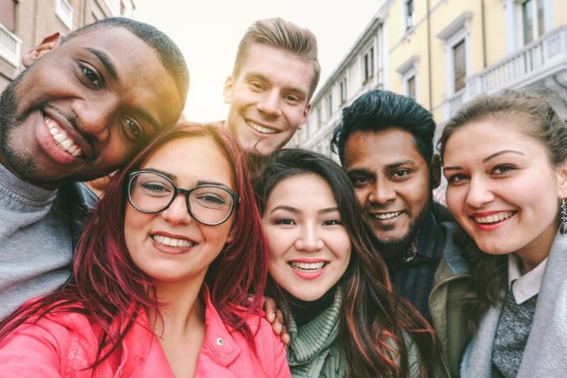 diverse group of friends take a selfie