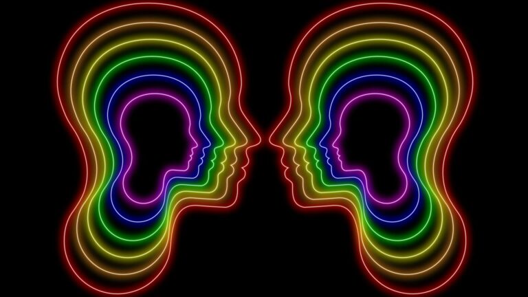 two neon light heads in pride colors