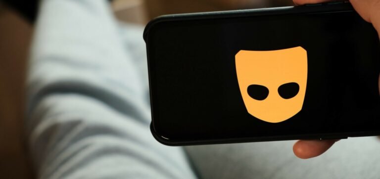 Grindr logo on a phone