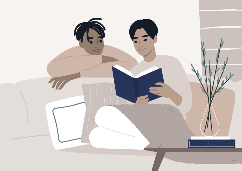 illustration of gay couple reading on the couch