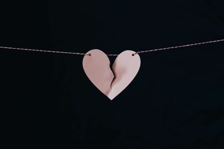 paper heart on a string ripped in the middle