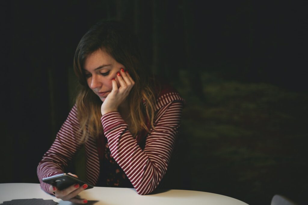 woman on phone considering dating after divorce