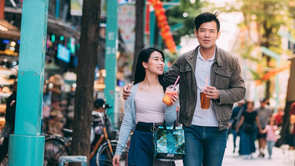 chinese dating couple walking down street