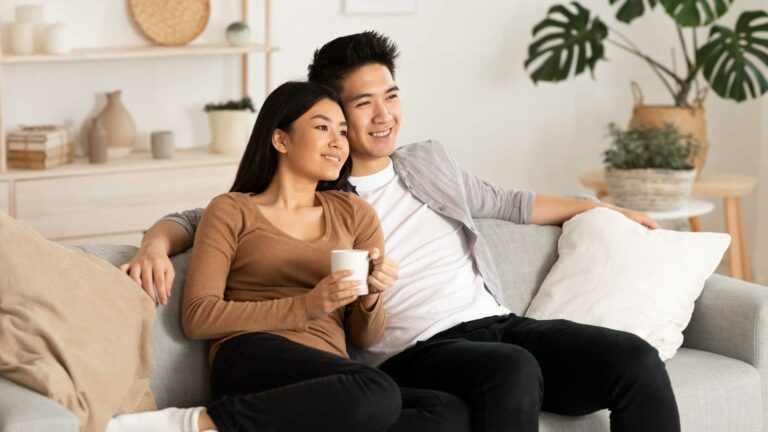 filipino dating couple on their couch